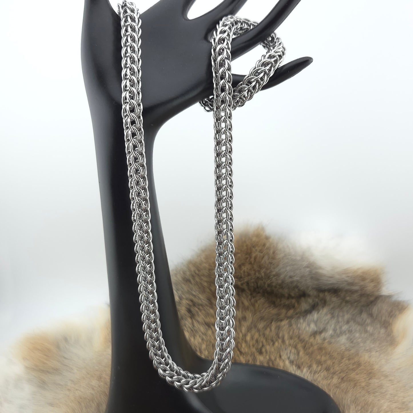 A stainless steel Full Persian necklace in 18g rings.