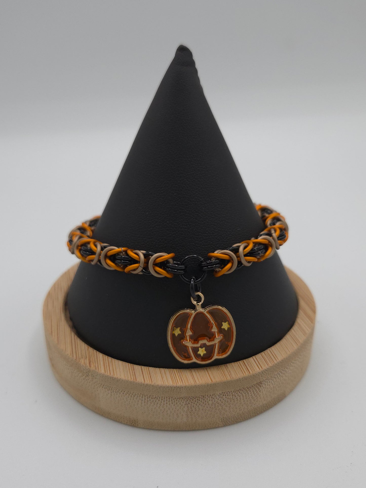 Black, Matte Taupe, and Matte Orange Bracelet with a Stary Pumpkin