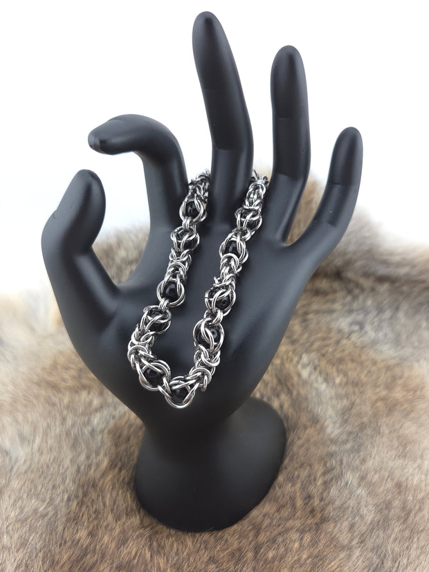 Stainless Steel and Captured Black Bead Bracelet