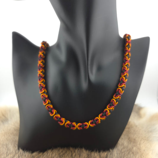 Byzantine chainmail necklace, handwoven in matte black, matte red, and matte orange premium anodized aluminum.