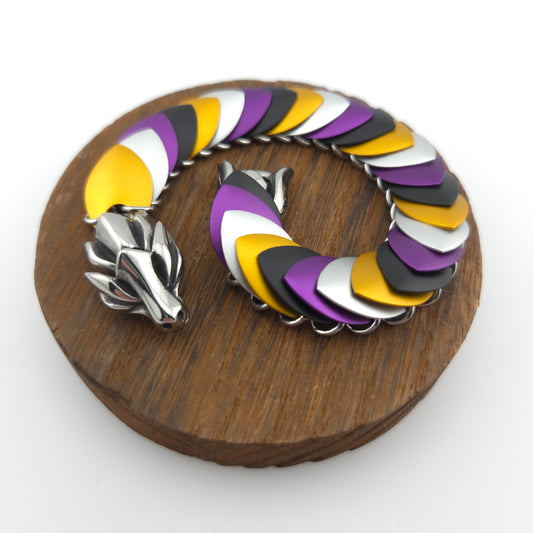 Dragon Scale Bracelet, with a stainless steel spine, premium anodized aluminum scales, and a solid stainless steel spring clasp shaped as a Dragon head.