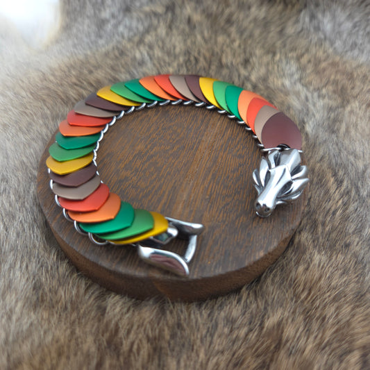 Dragon Scale Bracelet, with a stainless steel spine, premium anodized aluminum scales, and a solid stainless steel spring clasp shaped as a Dragon head.