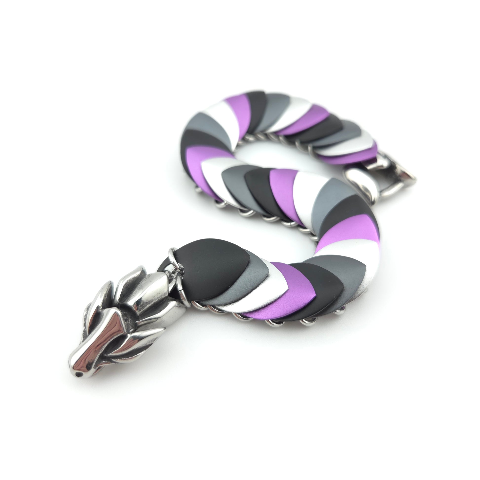 Dragon Scale Bracelet, with a stainless steel spine, premium anodized aluminum scales, and a solid stainless steel spring clasp shaped as a Dragon head.
