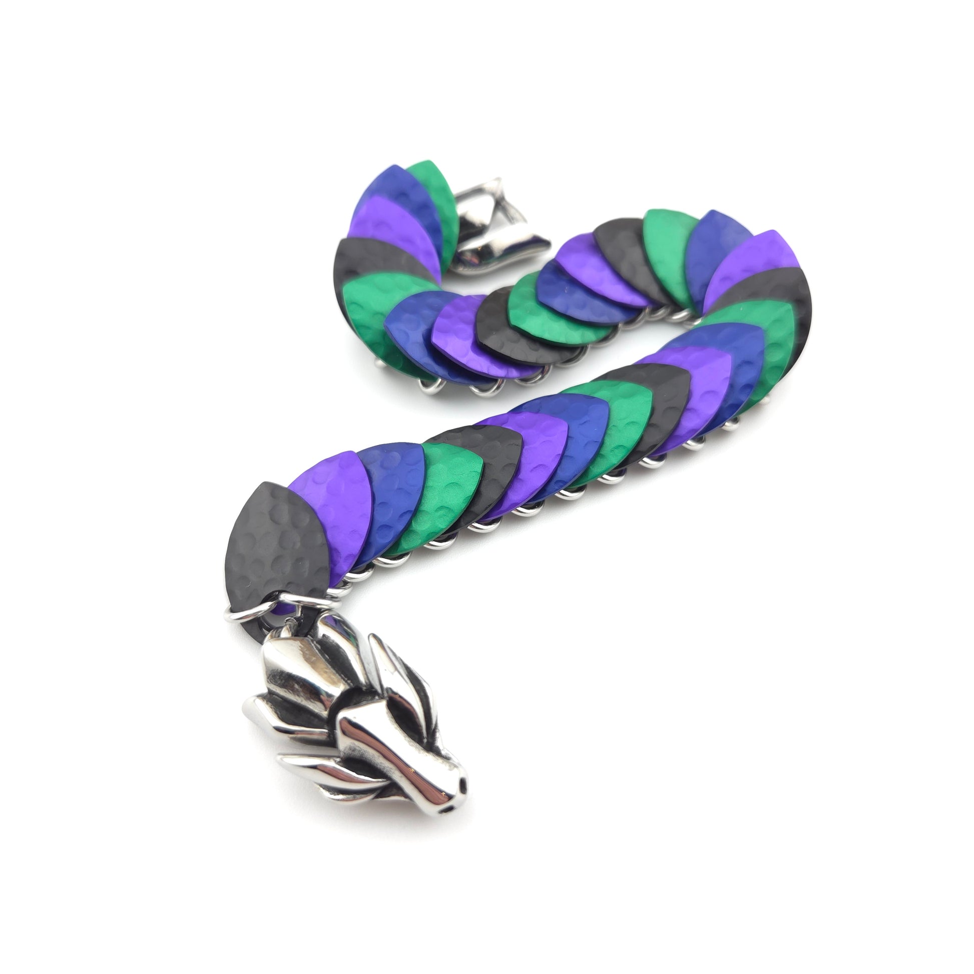 A dragon scale bracelet, handwoven with aluminum scales on a stainless steel spine with a solid stainless steel spring clasp.