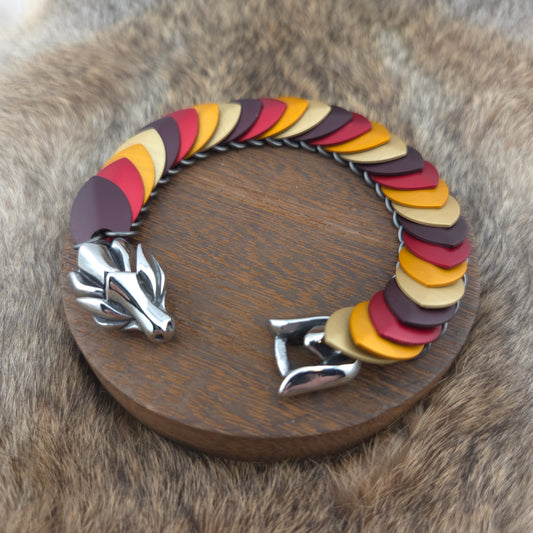 Dragon Scale Bracelet, with a stainless steel spine, premium anodized aluminum scales, and a solid stainless steel spring clasp shaped as a Dragon head.