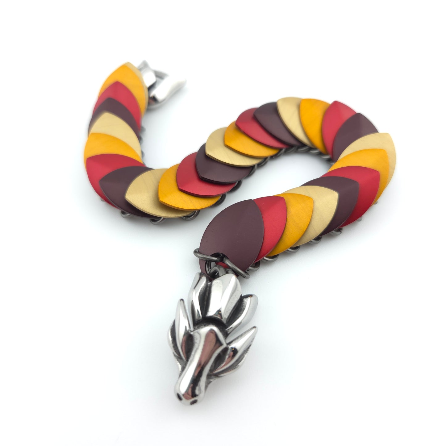 Dragon Scale Bracelet, with a stainless steel spine, premium anodized aluminum scales, and a solid stainless steel spring clasp shaped as a Dragon head.