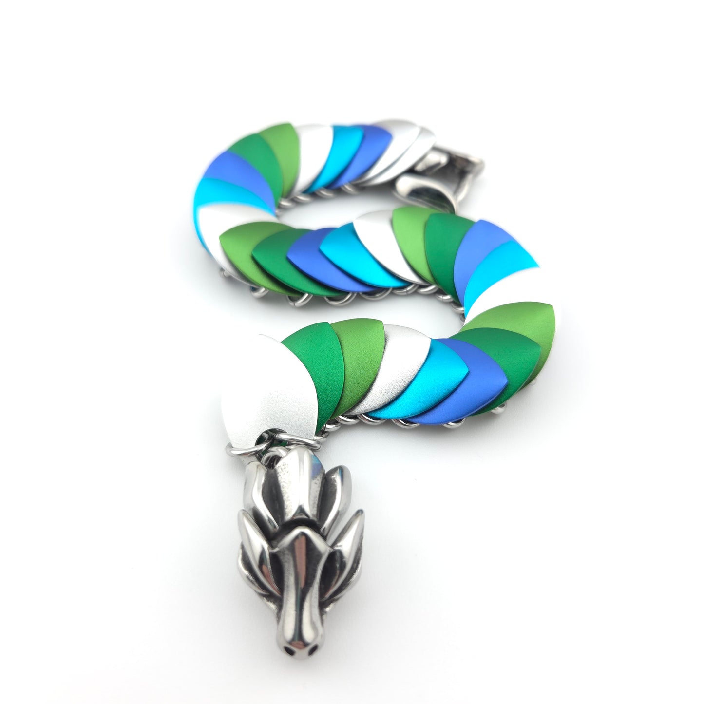 Dragon Scale Bracelet, with a stainless steel spine, premium anodized aluminum scales, and a solid stainless steel spring clasp shaped as a Dragon head.