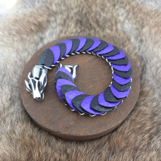 Dragon Scale Bracelet, with a stainless steel spine, premium anodized aluminum scales, and a solid stainless steel spring clasp shaped as a Dragon head.