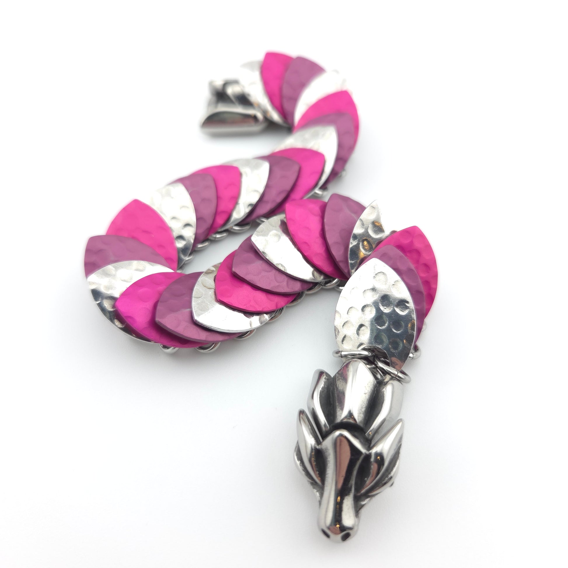 Dragon Scale Bracelet, with a stainless steel spine, premium anodized aluminum scales, and a solid stainless steel spring clasp shaped as a Dragon head.