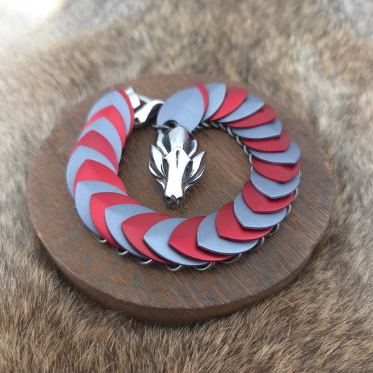 Dragon Scale Bracelet, with a stainless steel spine, premium anodized aluminum scales, and a solid stainless steel spring clasp shaped as a Dragon head.