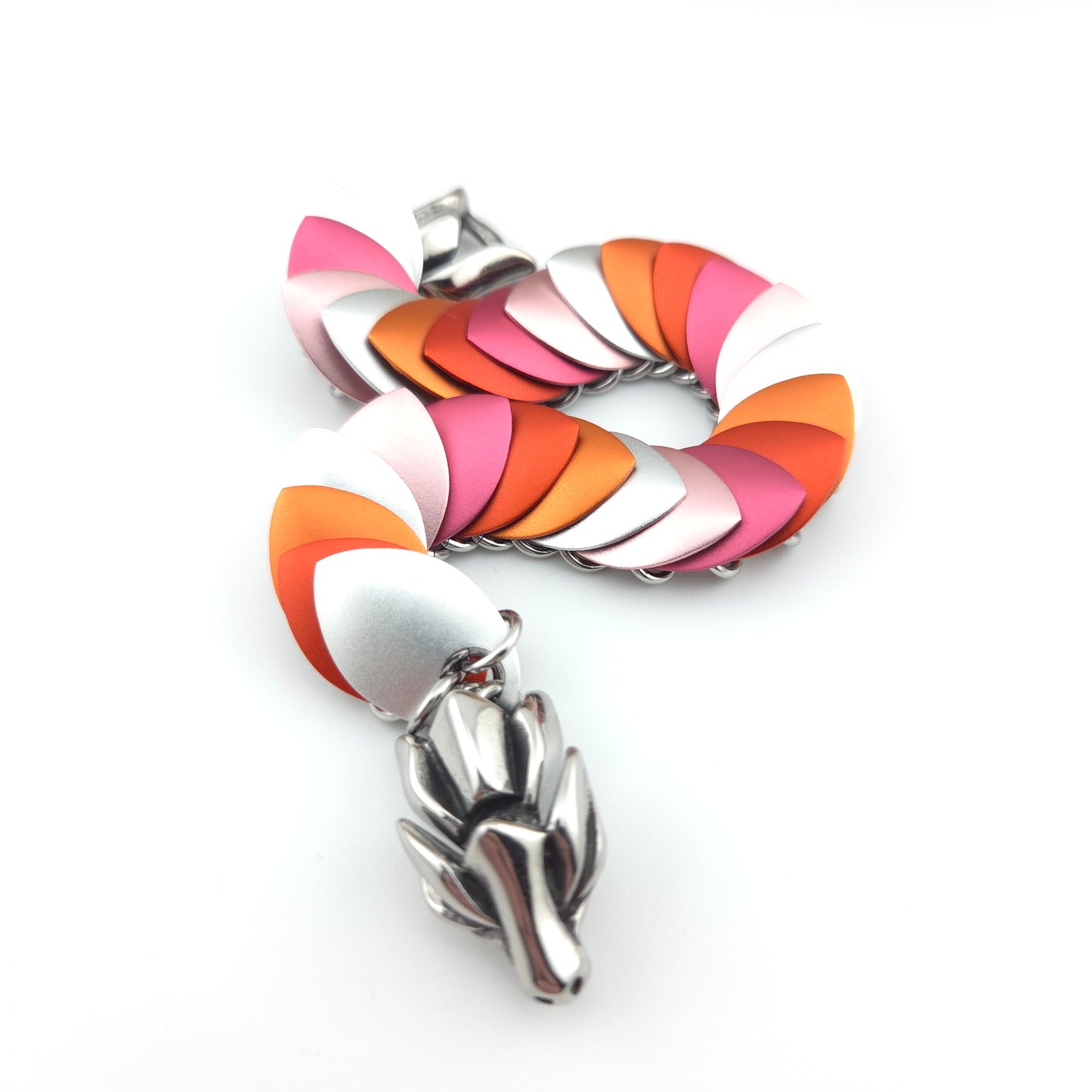 Dragon Scale Bracelet, with a stainless steel spine, premium anodized aluminum scales, and a solid stainless steel spring clasp shaped as a Dragon head.
