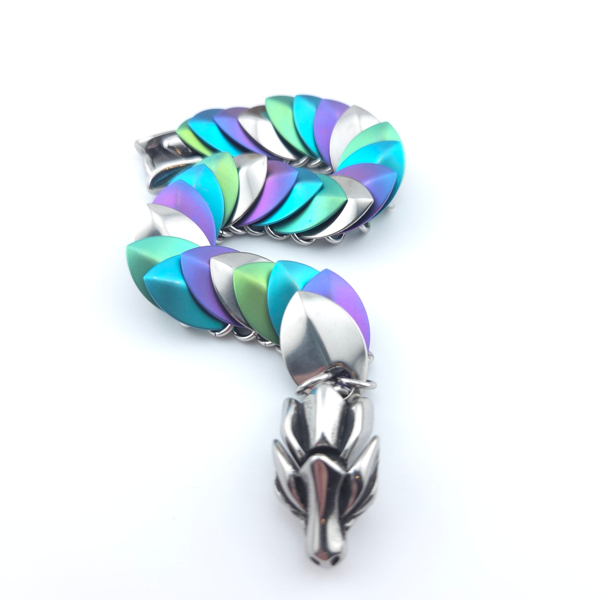 Dragon Scale Bracelet, handwoven with a stainless steel spine, silver, purple, teal, and green scales.