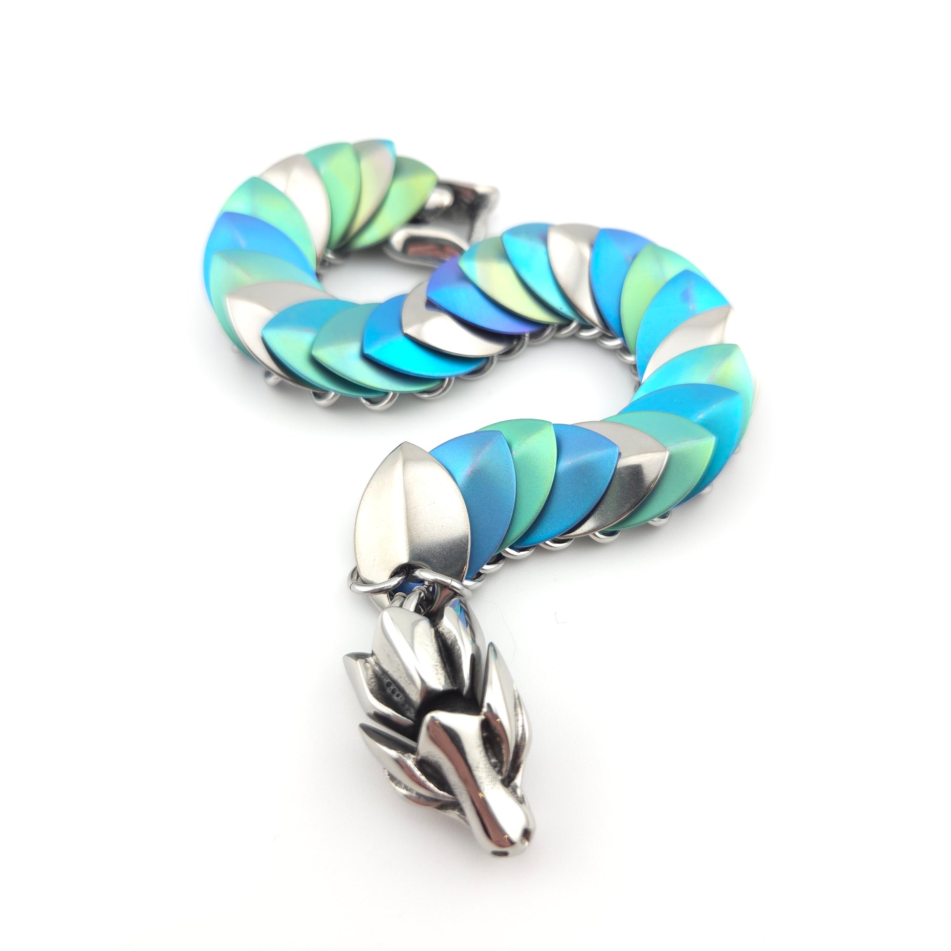 Dragon Scale Bracelet, with a stainless steel spine, anodized titanium  scales, and a solid stainless steel spring clasp shaped as a Dragon head.
