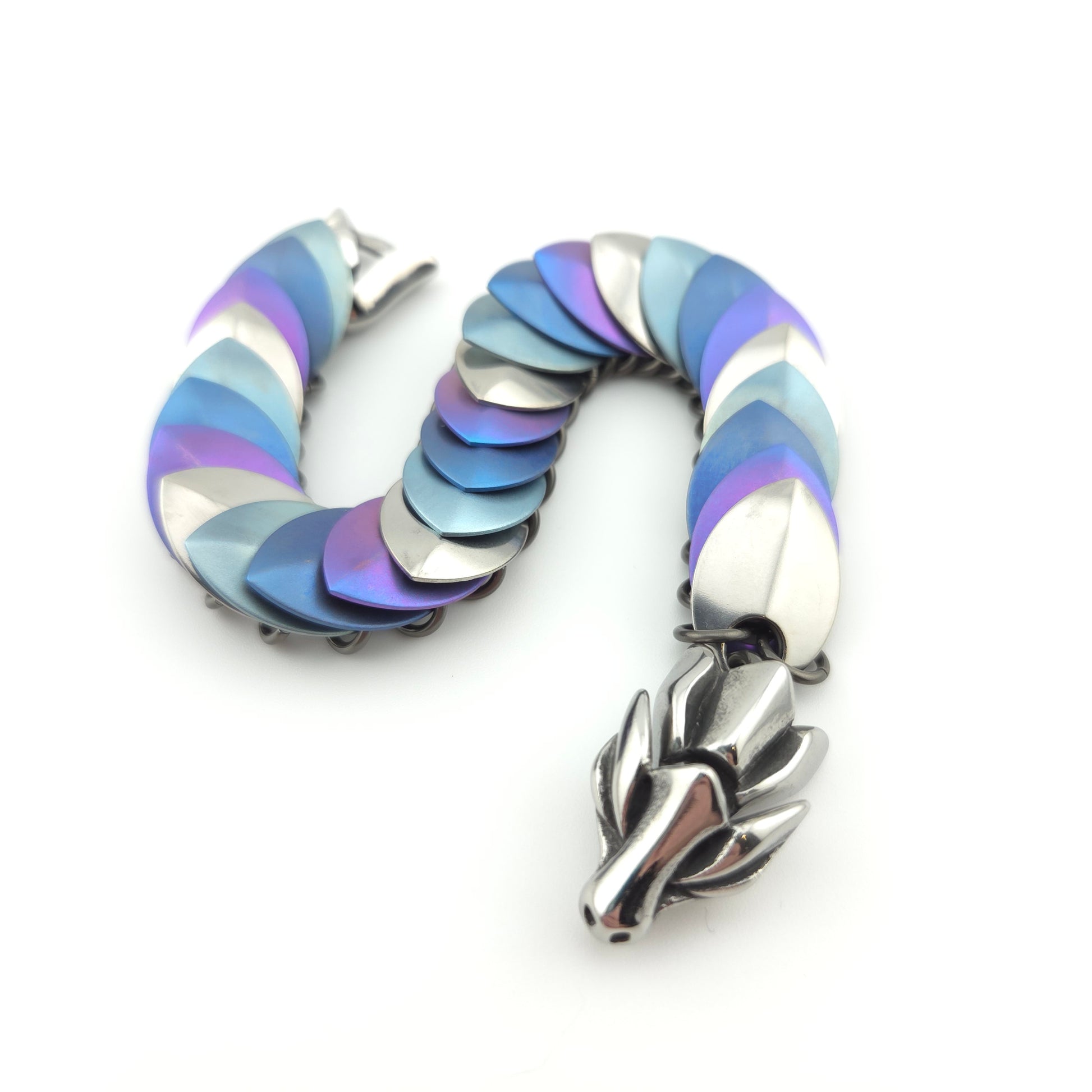 Dragon Scale Bracelet, with a stainless steel spine, stainless steel and anodized titanium  scales, and a solid stainless steel spring clasp shaped as a Dragon head.