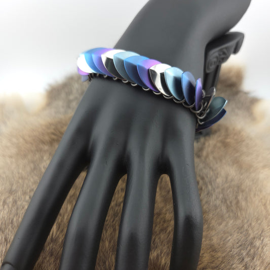 Dragon Scale Bracelet, with a stainless steel spine, stainless steel and anodized titanium  scales, and a solid stainless steel spring clasp shaped as a Dragon head.