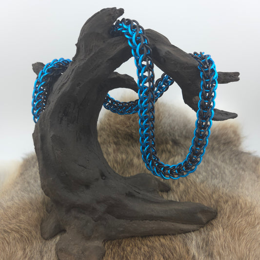 A 20" turquoise and black Full Persian chainmail necklace. Handwoven with premium anodized aluminum.